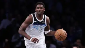 Timberwolves' Anthony Edwards leaves game after landing on foot of Nets coach, appears to avoid injury