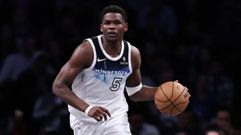 Timberwolves' Anthony Edwards leaves game after landing on foot of Nets coach, appears to avoid injury