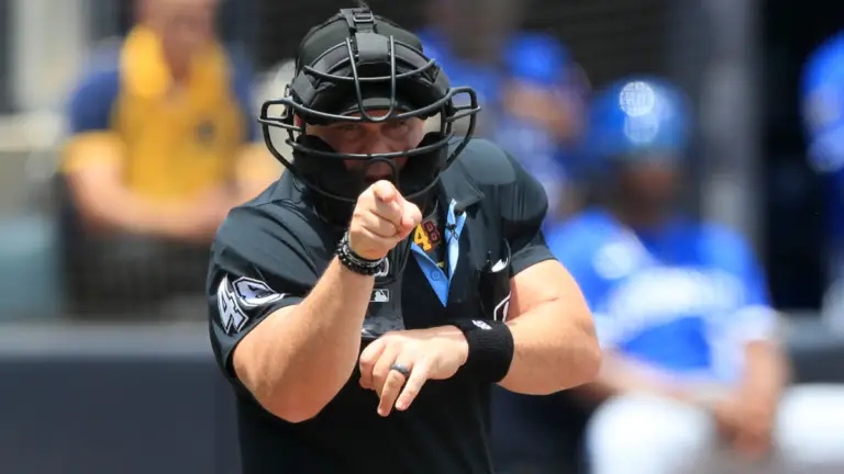 MLB changed its evaluation of umpires, leading to fewer called strikes on edges of zone, per report